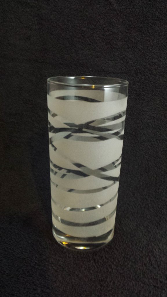 A hiball tumbler reverse etched with multiple banded loops