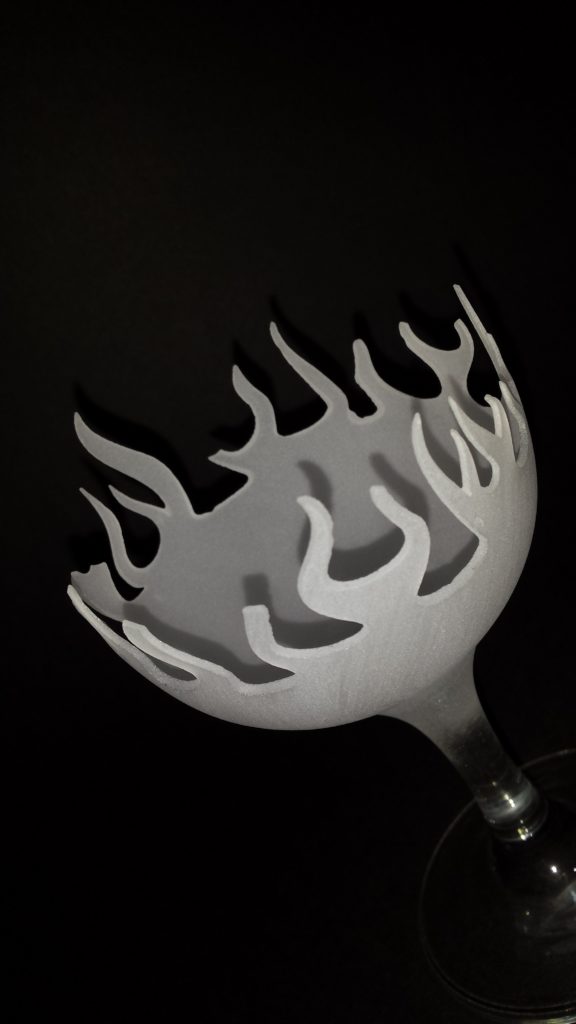 The hot glass a votive candle holder carved from a wine glass