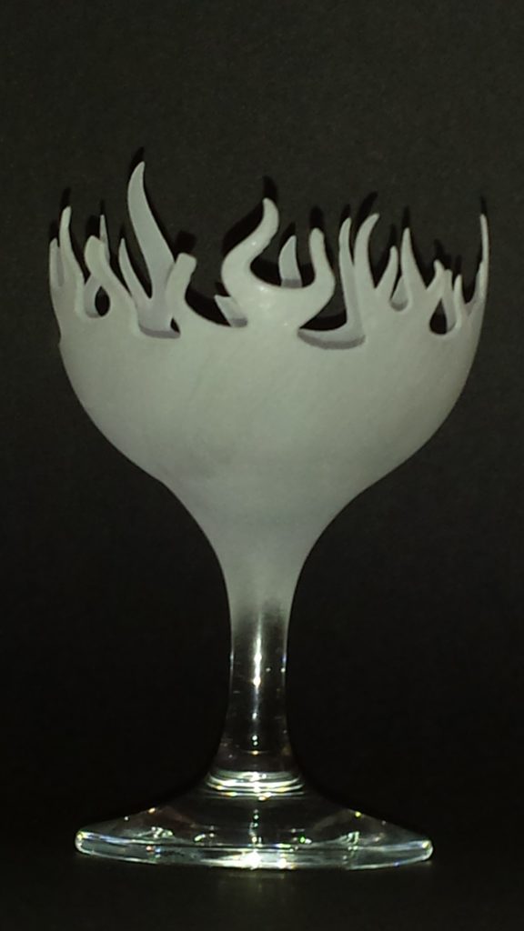 The hot glass a votive candle holder carved from a wine glass