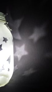 A large preserving jar reverse etched wit a star design for use as a nightlight